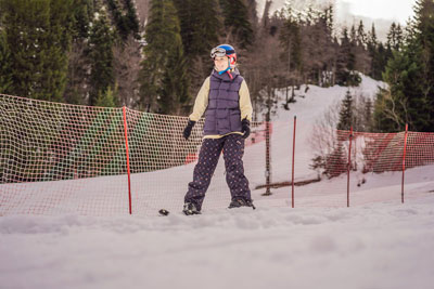 Skiers in Idaho enjoying snowboarding and ski slopes with great terrain and plenty of powder snow to make the best skiing vacation.