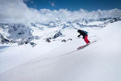 Idaho skier enjoting skiing and snowboarding in the Idaho mountains, ski lifts and ski trails. 